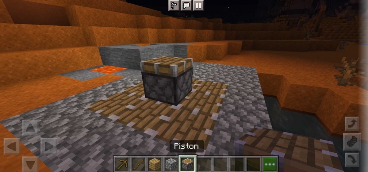 Pistons in a minecraft landscape with lava